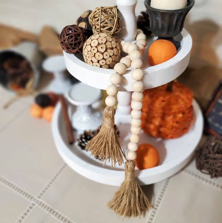 Handmade wood bead garland using 33 beads and natural-colored jute twine. No glue is used. Each bead strand is approximately 33 inches long.
